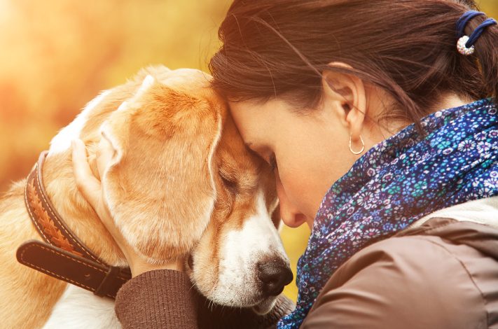 Woman resting on dog's head