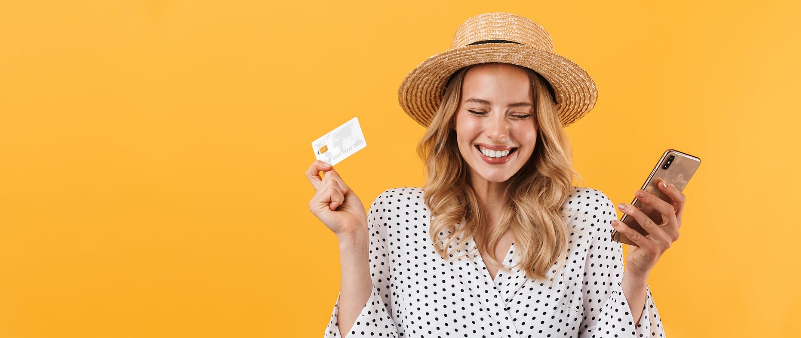 Woman holding phone and credit card